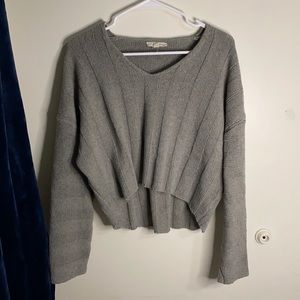 Gray sweater (could be off the shoulder)